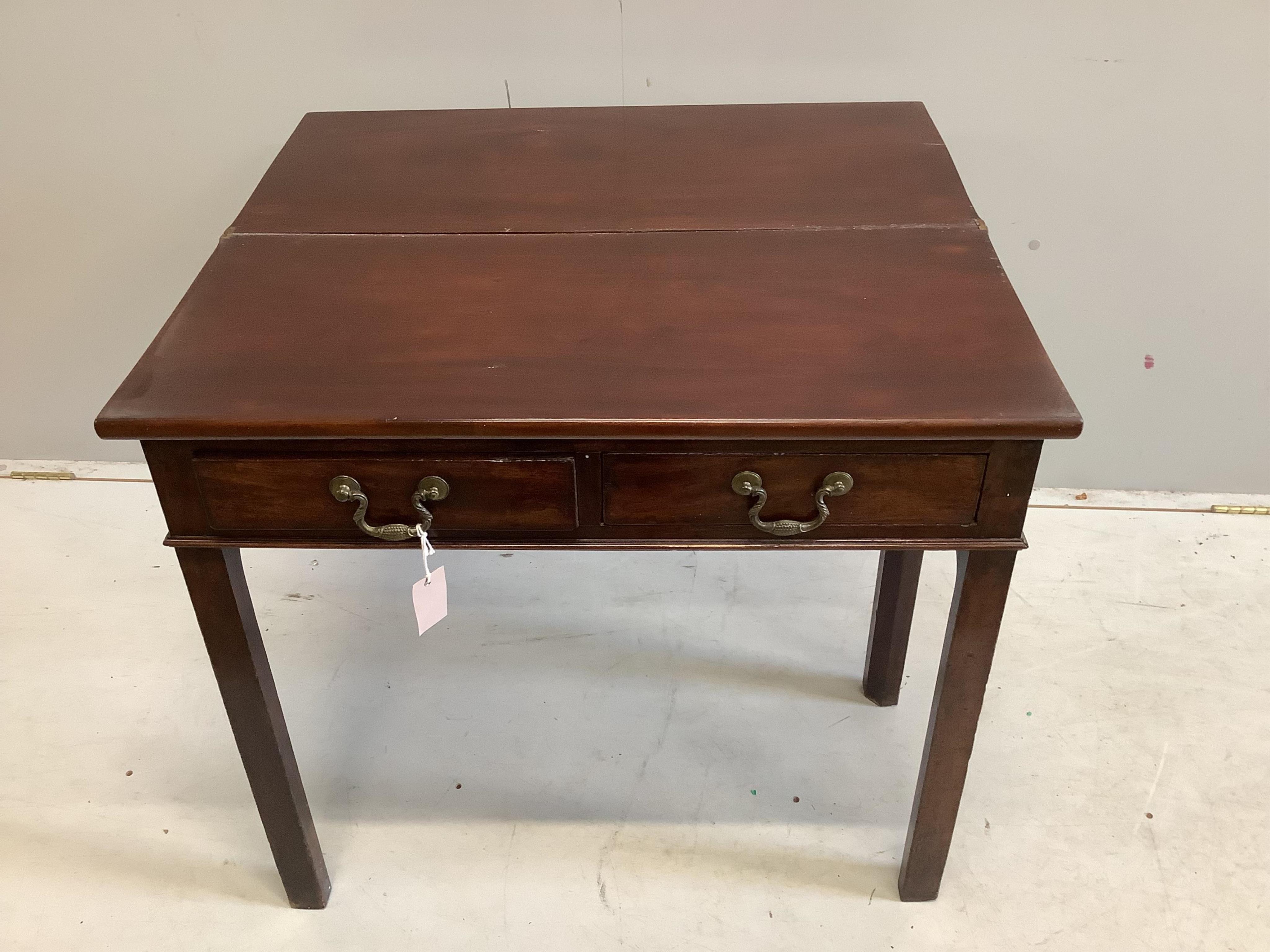 A George III rectangular mahogany folding tea table, width 80cm, depth 36cm, height 72cm. Condition - fair